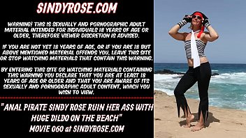 Play Anal pirate Sindy Rose ruin her ass with huge dildo on the beach